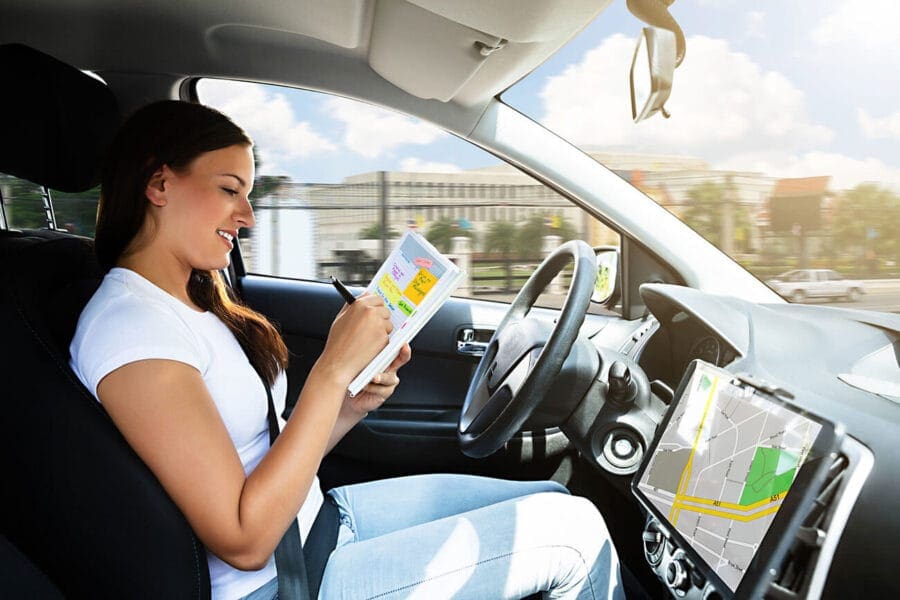 woman entering logbook for workers compensation travel claims in WA