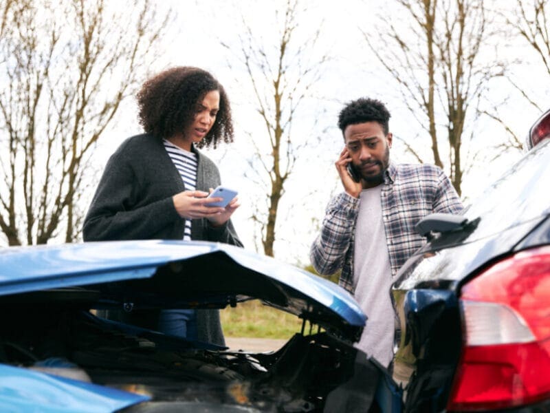 car accident victim photographing accident damage or injuries with their phone, demonstrating gathering evidence and seeking legal help from Foyle Legal