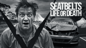 A distressed man, wearing a seatbelt, looks towards the camera. Beside him, a car crash scene is visible with a severely damaged vehicle. The text "SEATBELTS LIFE OR DEATH" is prominently displayed. The image is in black and white.