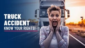 Woman with short hair looking shocked, standing in front of a large truck on a road. Text on the left reads "Truck Accident Know Your Rights!" in bold white letters against a blue background.